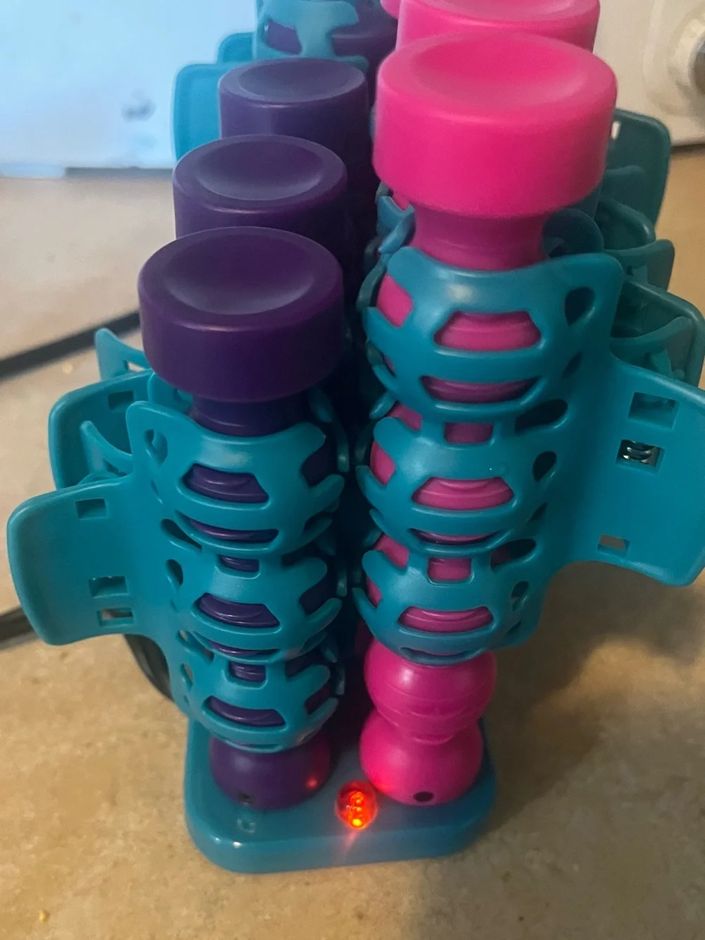 BedHead Purple Cosmetic Case with Teal and Pink Hair Rollers